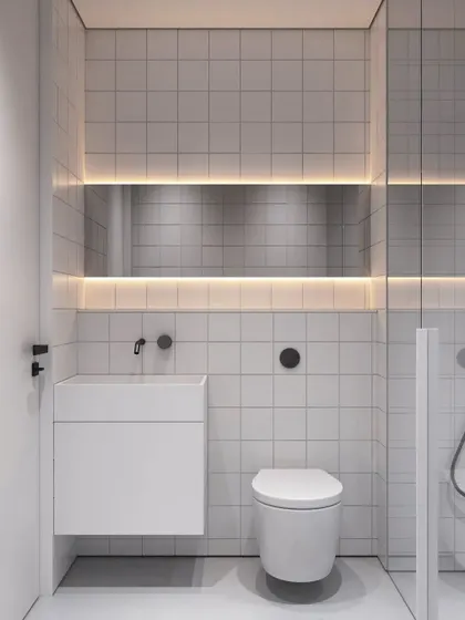 A concept for an affordable yet elegant toilet design for a business hotel. Using simple white tiles, a floating vanity, and integrated backlighting, we created a clean, minimalist, and functional space.