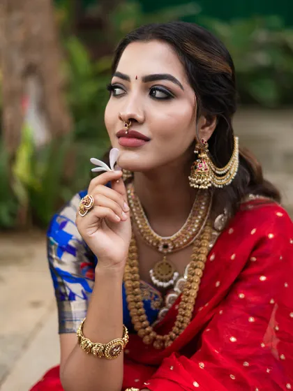 Another angle of this beautiful look, showing how the makeup complements the vibrant colors of the saree.