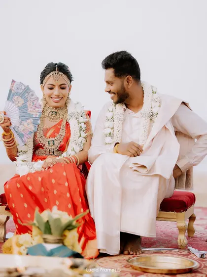 A lighthearted moment between the couple during their ceremony, sharing a smile.