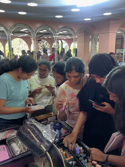 Students exploring different products during a pro course. Understanding textures, finishes, and color-matching is a fundamental skill for any makeup artist.