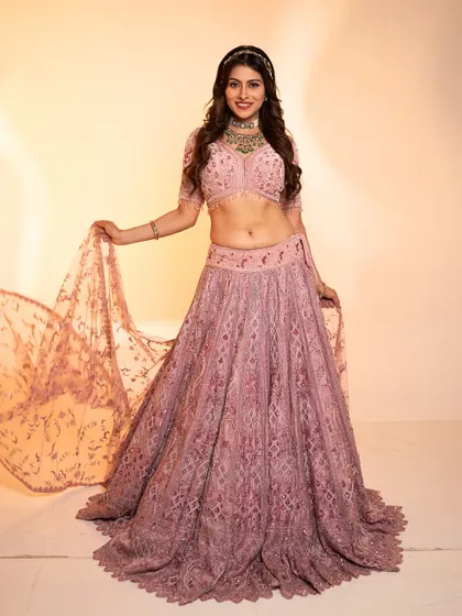 A beautiful shot of Aparna Dixit showing the flow and detail of the dusty rose lehenga.