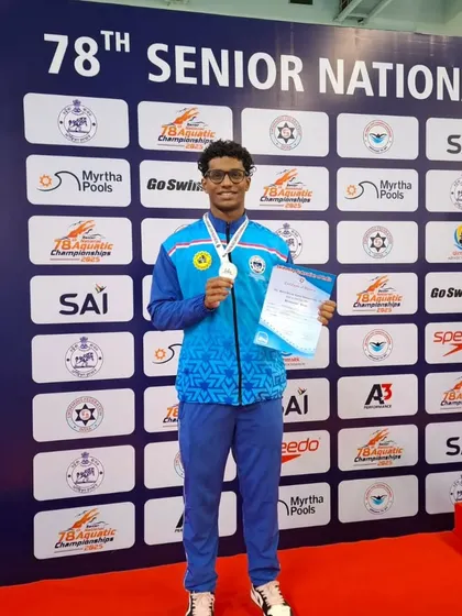 Tanish George Mathew posing with his silver medal.
