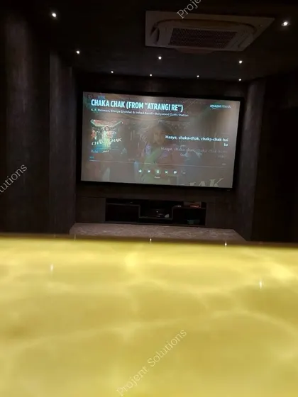 A duplicate image showing the large projector screen from the back of the room.