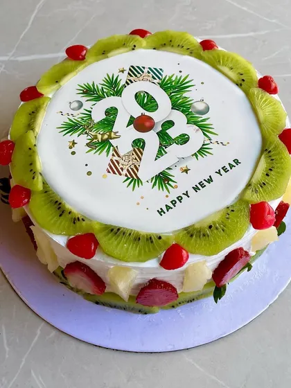 A fresh and fruity cake to start the New Year on a light note. This one is decorated with kiwi and cherries.