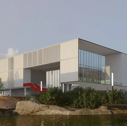 This rendering shows how the Dhruva campus integrates with a water body, reflecting our philosophy of blending architecture with natural elements. The building's clean, minimalist volume contrasts with the organic shapes of the rocks and water, creating a harmonious composition.