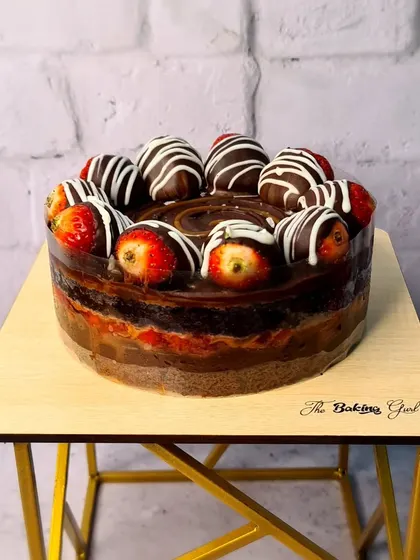 My Salted Caramel Chocolate Strawberry Bomb Cake. This cake is an explosion of flavor, with layers of chocolate cake, salted caramel, and fresh strawberries, topped with chocolate-dipped berries.