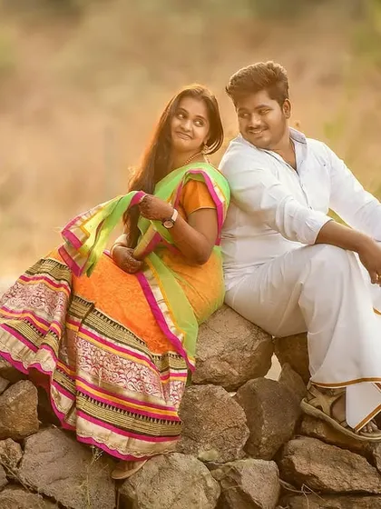 A serene pre-wedding moment captured at sunset. The warm light and traditional attire create a timeless and romantic image for this couple.
