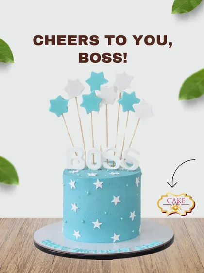 Cheers to the boss! This cheerful blue cake is decorated with white stars and topped with a "BOSS" sign and star wands, making it a great choice for Boss's Day or a work celebration.