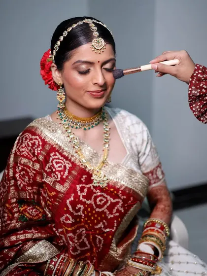 Another shot of the final touches. This angle shows the beautiful blend of her cheek color and the subtle highlight that gives her that 'lit from within' glow.