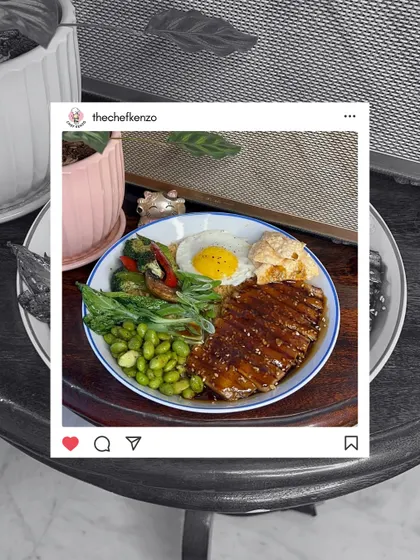 A perfectly plated Teriyaki bowl with a sunny-side-up egg, edamame, and grilled chicken, ready for its close-up.