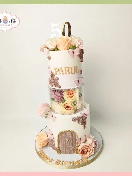 A floral fairytale for a 50th birthday. This unique tiered cake features a separator filled with beautiful roses, creating a magical floating garden effect.