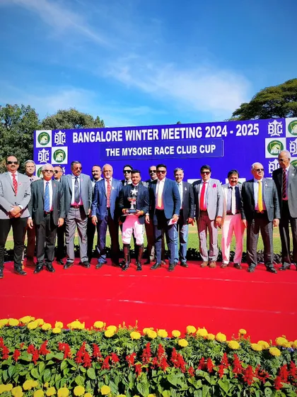 The presentation ceremony for The Mysore Race Club Cup with the winning team of Mayne Magic.