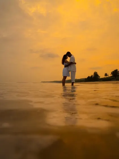 A pre-wedding shoot against a magnificent sunset sky. These sessions are about capturing your chemistry in a beautiful landscape, creating memories before the big day.