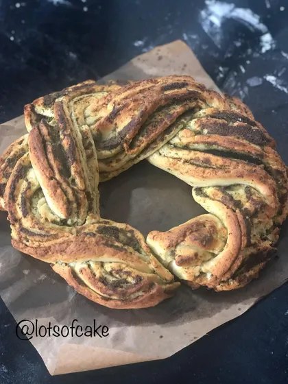 I call my pesto babka an 'Italian chutney' bread. It's a savory twist on the classic, with layers of fresh basil pesto swirled through the soft, braided dough.
