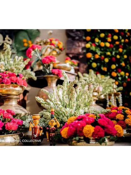 To infuse a playful vibe, we incorporated traditional Channapatna toys into the decor. These colourful wooden dolls, placed among the brassware and flowers, add a unique and charming touch that celebrates local craftsmanship.