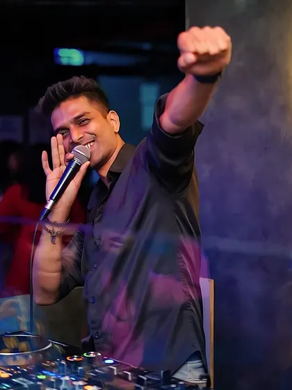 Grabbing the mic to connect with the crowd at Toca. This is the moment I bridge the gap between the booth and the dance floor.