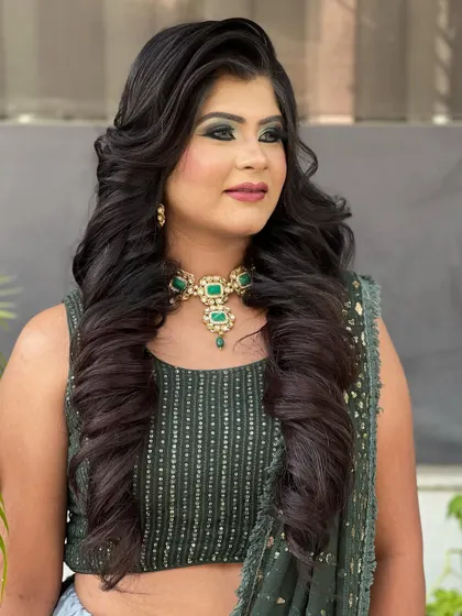 A close-up of the curls and makeup, showing how the hairstyle complements the overall look.