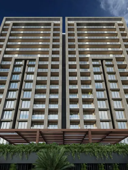 An upward perspective of our twin-tower Bandra residence, highlighting its clean, linear facade. The design ensures that the large, spacious apartments feel both airy and inviting, with a subtle yet impactful elevation.