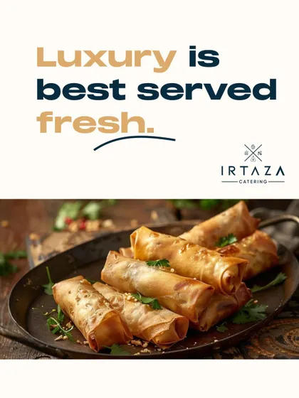 Freshly made spring rolls with a crispy, golden-brown wrapper, served on a rustic platter. A classic appetizer that is always prepared fresh on-site.