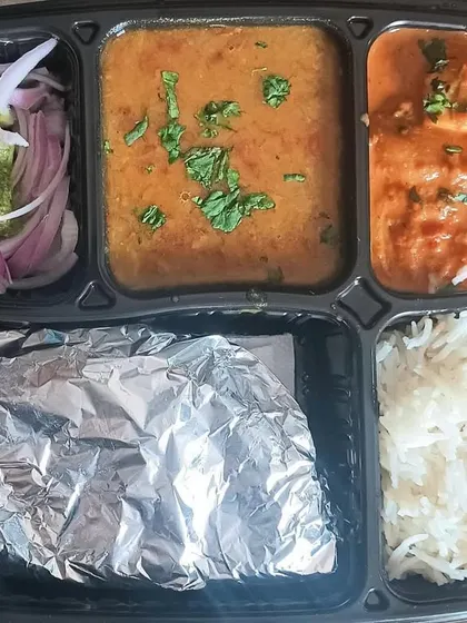 This thali features a delicious soya chaap masala, a dish I make on special request. Paired with dal, rice, and roti, it's a hearty and protein-rich option.