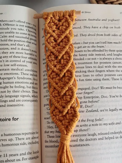 The detail in the heart-shaped knots of this macrame bookmark.