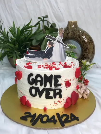 Who says bachelorette cakes can't be elegant and funny? This 'Game Over' cake was so much fun to create, featuring a humorous topper, the wedding date, and red heart details.