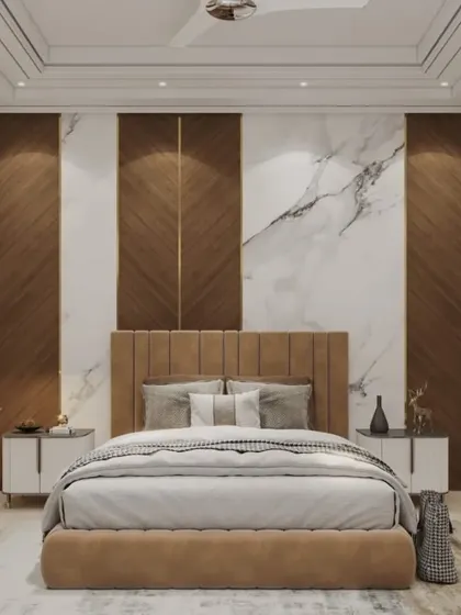 A luxurious bedroom design featuring a floor-to-ceiling accent wall with alternating panels of wood and white marble. The upholstered bed and gold trim add to the opulent feel of the space.