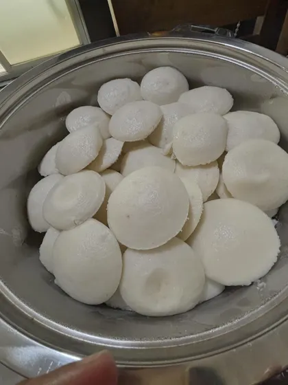 Another view of the freshly made idlis, showing their soft and porous texture.