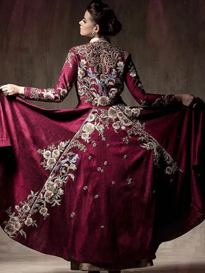A back view that reveals the stunning, detailed embroidery covering the entire jacket. This shot is essential for showing the 360-degree artistry of a couture piece.