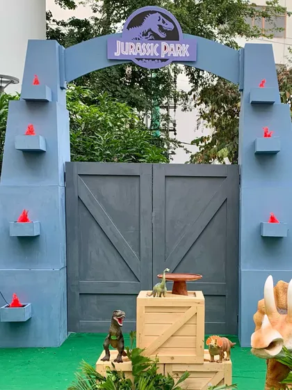 We can customize our Jurassic Park gate with details like torch lights to add extra drama and excitement to your event entrance.