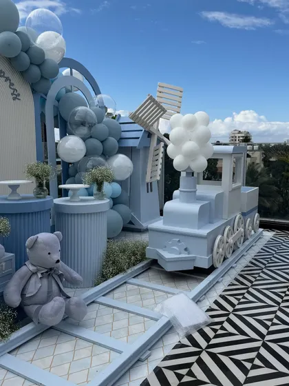 All aboard for a memorable celebration with our charming baby blue dessert train prop. This versatile piece can serve as a unique dessert cart or an interactive photo booth for children's birthday parties, complete with a windmill and balloon steam.