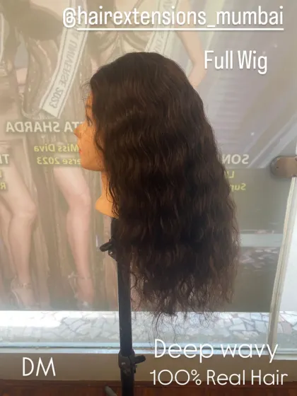 This is a full wig with a deep wavy texture, made from 100% real hair. Wigs offer a complete transformation and are a great option for total coverage.