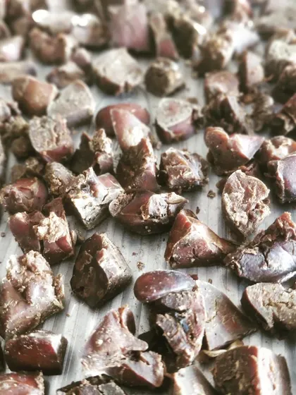 Another batch of our organ meat treats, fresh from the oven. We prepare them with care, ensuring every piece is a perfect, chewy bite.