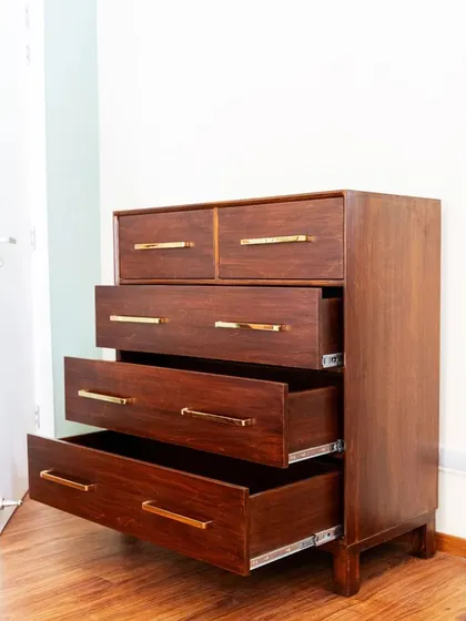 The chest of drawers with some drawers pulled out, demonstrating their smooth telescopic channels and deep storage capacity.