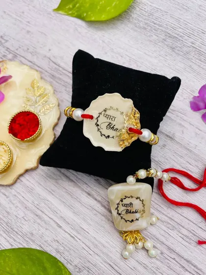 This is a matching set for "Pyara Bhai" (dear brother) and "Pyari Bhabhi" (dear sister-in-law), a popular choice for celebrating the whole family.
