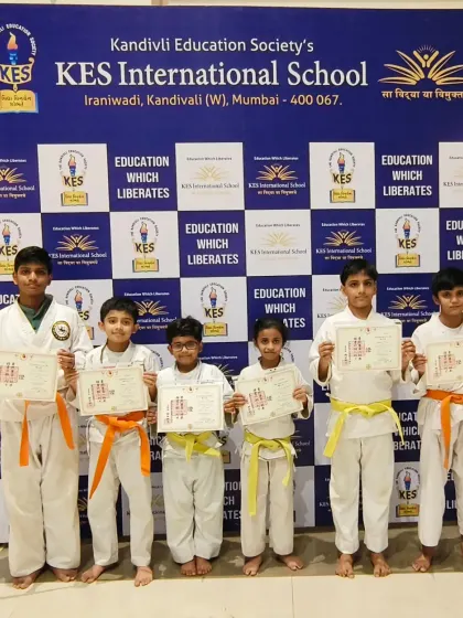A mix of orange and yellow belts from our KES International School branch. Each student has shown great progress in their karate journey.