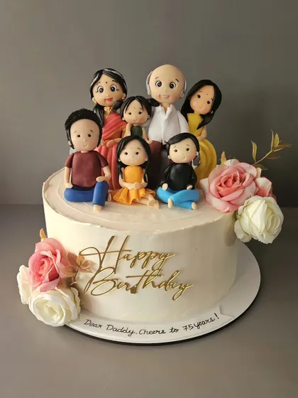 Familia. A 3kg orange cake for a 75th birthday, featuring a beautiful family portrait handcrafted from fondant.