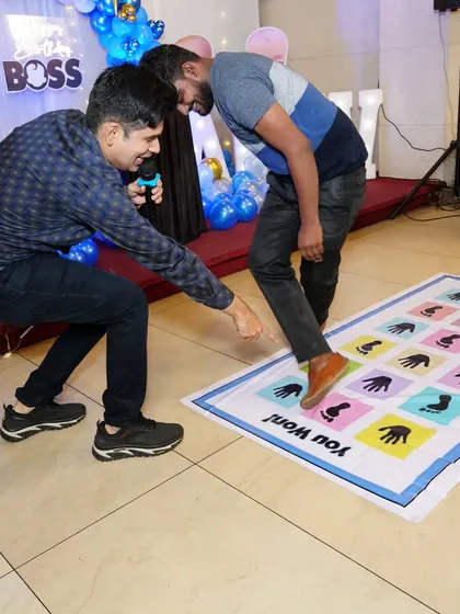 Demonstrating the correct move for the mat game to a participant.