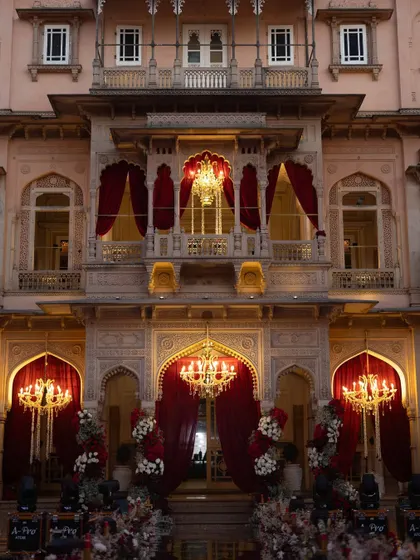 A closer view of the palace facade, adorned with opulent chandeliers and rich red drapery. This showcases our attention to detail in creating a cohesive, luxurious atmosphere.