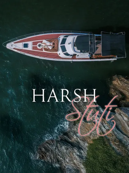 An aerial drone shot captures a couple relaxing on the bow of a yacht in the serene blue waters of Goa. This highlights my destination photography services, creating luxurious and cinematic memories wherever your story takes you.