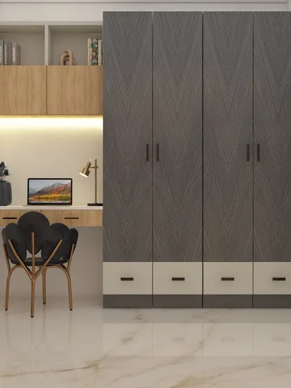 This bedroom features a practical and stylish wardrobe with an attached study table. The dark wood grain of the wardrobe contrasts with the lighter wood of the desk and shelves, creating a modern and functional personal workspace.