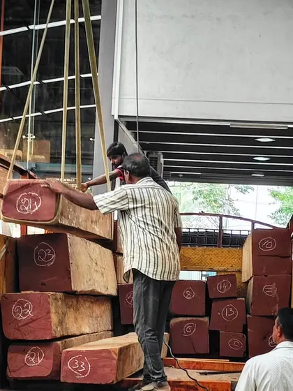 This is where quality begins. Our team carefully unloads a fresh stock of solid Burma Teak logs at our timber yard. By controlling the entire process from raw log to finished product, we ensure there are no compromises on the strength and beauty of the wood used in your home.