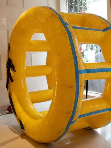 An inflatable zorb-like wheel provided a fun and active game for the kids at the party.