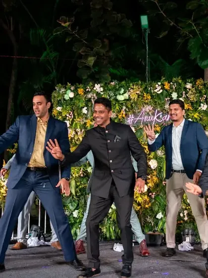The groom and his friends in a perfectly synchronized line. This shows how even non-dancers can look sharp and coordinated with a little practice.