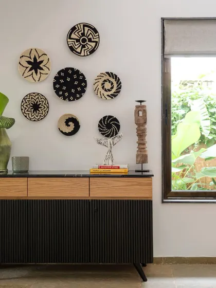 At Villa Shai, every corner tells a story of local craft. This vignette features a custom sideboard and a collection of handwoven baskets from Goan artisans, reflecting our commitment to conscious choices and connection to place.