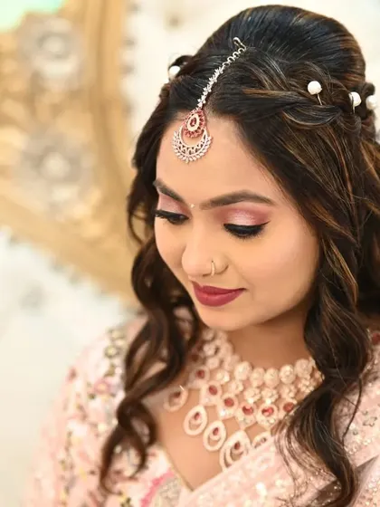 This engagement look was all about soft glam. I gave the bride-to-be flowing curls with a delicate hair accessory and makeup that enhanced her natural features.