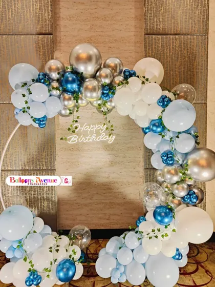 A frontal view of the blue, white, and silver balloon arch, perfect for a sophisticated birthday celebration.