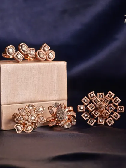 Immerse yourself in the intricate whispers of our designs. This collection of rose gold and diamond rings showcases a variety of styles, from floral to geometric.