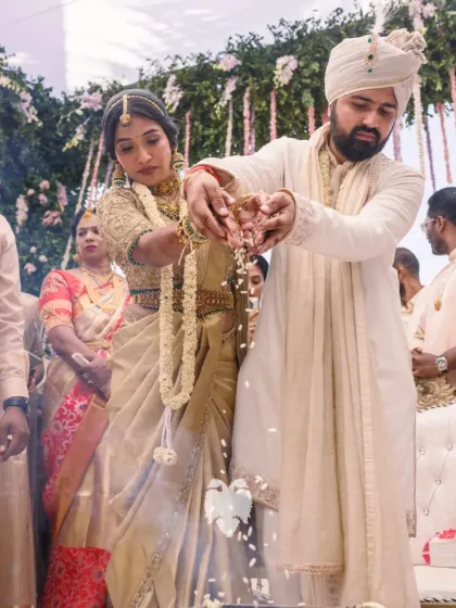 A candid moment from Aparna's wedding ceremony, her gold blouse shimmering.