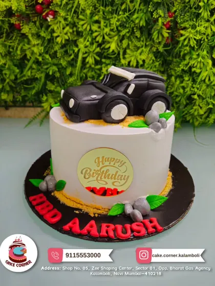 Rev up the party with this cool black SUV cake for Aarush. The fondant car on top of the cake is perfect for any young car enthusiast.